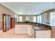 Open kitchen with granite counters and stainless steel appliances flowing into living area with fireplace at 321 Bounty Ln, Charleston, SC 29412