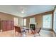 Spacious living room featuring a cozy fireplace, neutral paint, ceiling fan, and natural light at 321 Bounty Ln, Charleston, SC 29412