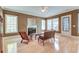 Bright living room featuring a fireplace, ample natural light, and hardwood flooring at 321 Bounty Ln, Charleston, SC 29412