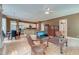 Spacious living room featuring hardwood floors, ceiling fan, and seamlessly flows into the kitchen at 321 Bounty Ln, Charleston, SC 29412