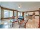 Open-concept living area with hardwood floors, bright windows, and modern ceiling fan at 321 Bounty Ln, Charleston, SC 29412