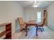 Home office with a large wooden desk, comfortable chairs, and ample natural light at 321 Bounty Ln, Charleston, SC 29412