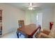 Bright home office with a wooden desk, bookshelves, and a ceiling fan at 321 Bounty Ln, Charleston, SC 29412