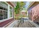 Outdoor patio with wood flooring, metal table and chairs and a cozy, private setting at 321 Bounty Ln, Charleston, SC 29412