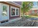 Outdoor patio with a weathered wooden deck, table and chairs, and leafy green backdrop at 321 Bounty Ln, Charleston, SC 29412