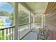 A cozy porch with white pillars, chairs, and a lovely view of the neighborhood at 321 Bounty Ln, Charleston, SC 29412