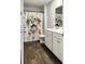 Bright bathroom featuring a white vanity with dual sinks, stylish flooring and a fun shower curtain at 323 Bear Paw Ln, Summerville, SC 29486