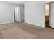 Unfurnished bedroom featuring neutral walls, plush carpeting, and two doorways for optimal flow at 323 Bear Paw Ln, Summerville, SC 29486