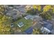 Aerial view of the property, showcasing the home, outbuildings, and surrounding trees and landscaping at 33 Elliott Ct, Walterboro, SC 29488