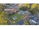 Aerial view of the .46 acre lot, showcasing the home, outbuildings, and surrounding trees and landscaping at 33 Elliott Ct, Walterboro, SC 29488