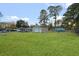 Expansive backyard featuring a large manicured lawn and detached metal storage building at 33 Elliott Ct, Walterboro, SC 29488