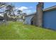 Backyard with mature trees, a storage shed, and a well maintained lawn at 33 Elliott Ct, Walterboro, SC 29488