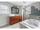 Bathroom features a vanity with a white countertop, a tub, and natural lighting at 33 Elliott Ct, Walterboro, SC 29488