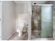 Tiled bathroom with glass shower and toilet at 33 Elliott Ct, Walterboro, SC 29488
