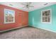 Bright bedroom featuring dual windows, overhead fan and unique dual-tone wall design, all set over cozy carpet flooring at 33 Elliott Ct, Walterboro, SC 29488