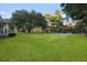 Inviting front yard featuring lush green lawn and mature trees, enhancing this home's curb appeal at 33 Elliott Ct, Walterboro, SC 29488