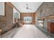 Spacious living room with brick fireplace, wood paneling, and stair access at 33 Elliott Ct, Walterboro, SC 29488