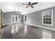 Bright living room boasts hardwood floors, high ceilings, and multiple windows at 33 Elliott Ct, Walterboro, SC 29488