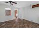 Bright living room features a ceiling fan and window to another room at 33 Elliott Ct, Walterboro, SC 29488
