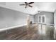 Open concept living room with sleek hardwood floors, high ceilings, and a sliding door at 33 Elliott Ct, Walterboro, SC 29488