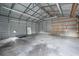 Spacious interior of a metal storage building featuring a concrete floor and fluorescent lighting at 33 Elliott Ct, Walterboro, SC 29488