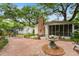 Spacious backyard featuring a brick patio, comfortable seating, and a decorative water feature at 344 Lantana Dr, Charleston, SC 29407