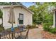 Charming backyard featuring a brick patio, a guest house, and lush landscaping at 344 Lantana Dr, Charleston, SC 29407