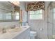 Bright bathroom with a white vanity, marble walls, and modern fixtures at 344 Lantana Dr, Charleston, SC 29407