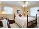 Charming bedroom with a wooden bed frame and soft, natural light at 344 Lantana Dr, Charleston, SC 29407