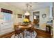 Charming dining area with a round wood table, seating for four, and a decorative light fixture at 344 Lantana Dr, Charleston, SC 29407