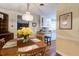 Bright dining area with wood table, decorative lighting, and view of the adjacent kitchen at 344 Lantana Dr, Charleston, SC 29407