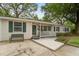 Attractive single-story home showcasing a covered front porch and a well-manicured yard at 344 Lantana Dr, Charleston, SC 29407