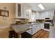 Well-lit kitchen featuring white cabinetry, granite countertops, and modern appliances at 344 Lantana Dr, Charleston, SC 29407