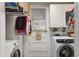 Well-organized laundry room with modern washer and dryer units and ample storage cabinets at 344 Lantana Dr, Charleston, SC 29407