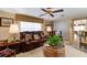 Cozy living room with a comfortable leather sofa and a decorative ceiling fan at 344 Lantana Dr, Charleston, SC 29407