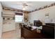 Home office with a large desk, built-in shelving, and a comfortable chair at 344 Lantana Dr, Charleston, SC 29407