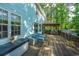 Expansive back deck with cozy seating, a full outdoor kitchen, and peaceful views of the backyard at 3738 Station Point Ct, Mount Pleasant, SC 29466