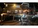 Exterior night view of backyard with overhead lighting, an outdoor table set, and parking at 3738 Station Point Ct, Mount Pleasant, SC 29466