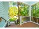 Relaxing view from a cozy, wood-floored balcony featuring classic railings and potted flower accents at 3738 Station Point Ct, Mount Pleasant, SC 29466