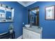 Modern bathroom with blue walls, decorative mirror, and granite countertop with a vessel sink at 3738 Station Point Ct, Mount Pleasant, SC 29466
