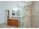 Elegant bathroom featuring dual sinks, granite countertops, and a tiled glass shower at 3738 Station Point Ct, Mount Pleasant, SC 29466
