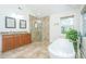 Bright bathroom with a freestanding tub, glass shower, and double vanity sinks at 3738 Station Point Ct, Mount Pleasant, SC 29466