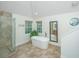 Bright bathroom featuring a freestanding tub, glass shower, and natural light from the windows at 3738 Station Point Ct, Mount Pleasant, SC 29466