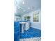 Light-blue bathroom featuring double pedestal sinks, large mirror, and bright lighting at 3738 Station Point Ct, Mount Pleasant, SC 29466