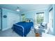 Inviting bedroom featuring large windows, light blue walls, and well-appointed details at 3738 Station Point Ct, Mount Pleasant, SC 29466