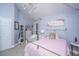 Charming bedroom with vaulted ceiling, pink bedding, and elegant decor at 3738 Station Point Ct, Mount Pleasant, SC 29466