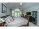 Comfortable bedroom featuring vaulted ceilings and French doors to balcony at 3738 Station Point Ct, Mount Pleasant, SC 29466