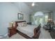 Comfortable bedroom with vaulted ceilings, French doors, and light neutral tones at 3738 Station Point Ct, Mount Pleasant, SC 29466