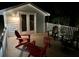 Outdoor space with white railings featuring red and gray Adirondack chairs and a small round table at 3738 Station Point Ct, Mount Pleasant, SC 29466