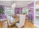 Formal dining room with a modern chandelier, lots of light and lavender colored walls at 3738 Station Point Ct, Mount Pleasant, SC 29466